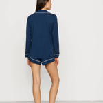 Navy blue Tencel™ modal pajama set featuring a short-sleeve button-front top and matching shorts.