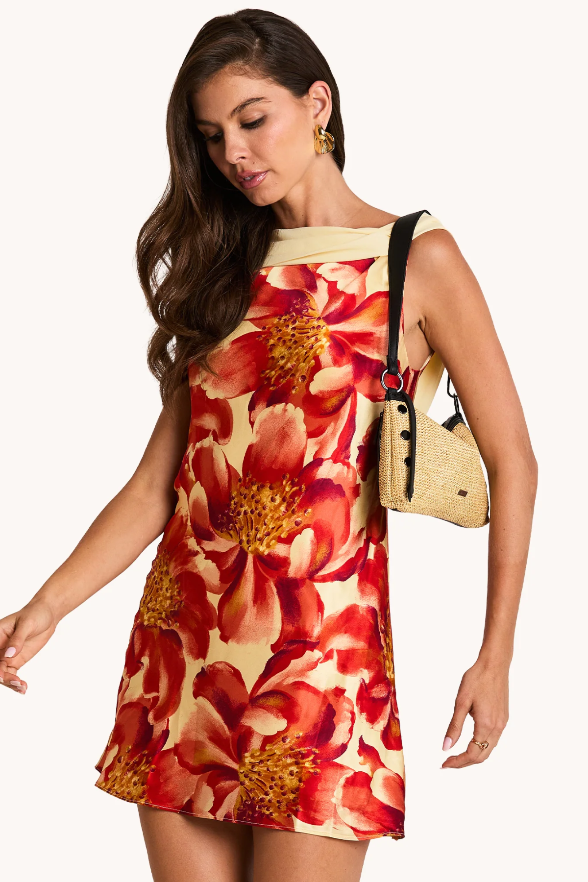 Woman wearing a floral dress with a beige background