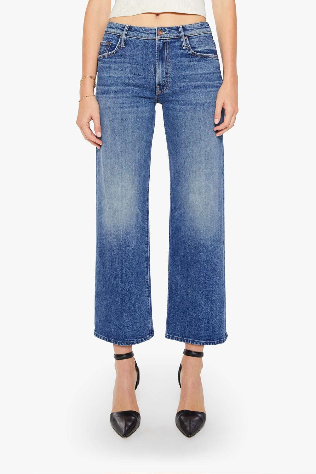 Blue jeans worn by a person on a white background