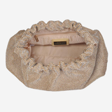 A beige and gold rhinestone-embellished clutch bag with a scalloped edge, shown from a top-down view on a light gray background.