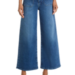 A model wearing a pair of blue wide-leg cropped denim jeans with a black belt, styled with black pointed-toe heels against a white studio background.
