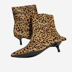 A pair of pointed-toe ankle boots with a tan and black leopard print pattern and kitten heels, shown against a plain light gray background.