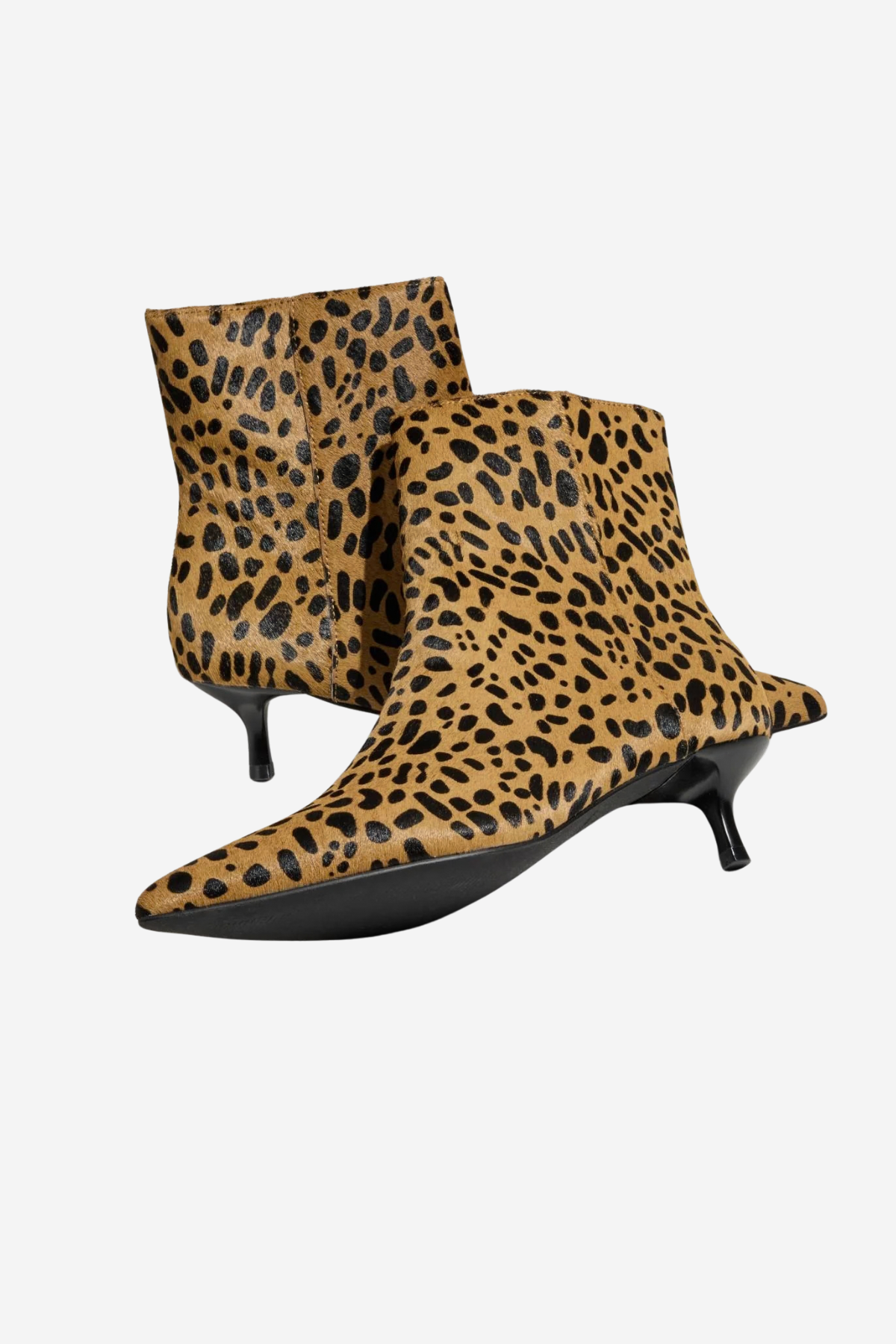 A pair of pointed-toe ankle boots with a tan and black leopard print pattern and kitten heels, shown against a plain light gray background.