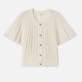 Cream-colored ribbed cardigan with gold buttons on a white background
