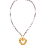 Necklace with a gold heart-shaped pendant on a white background