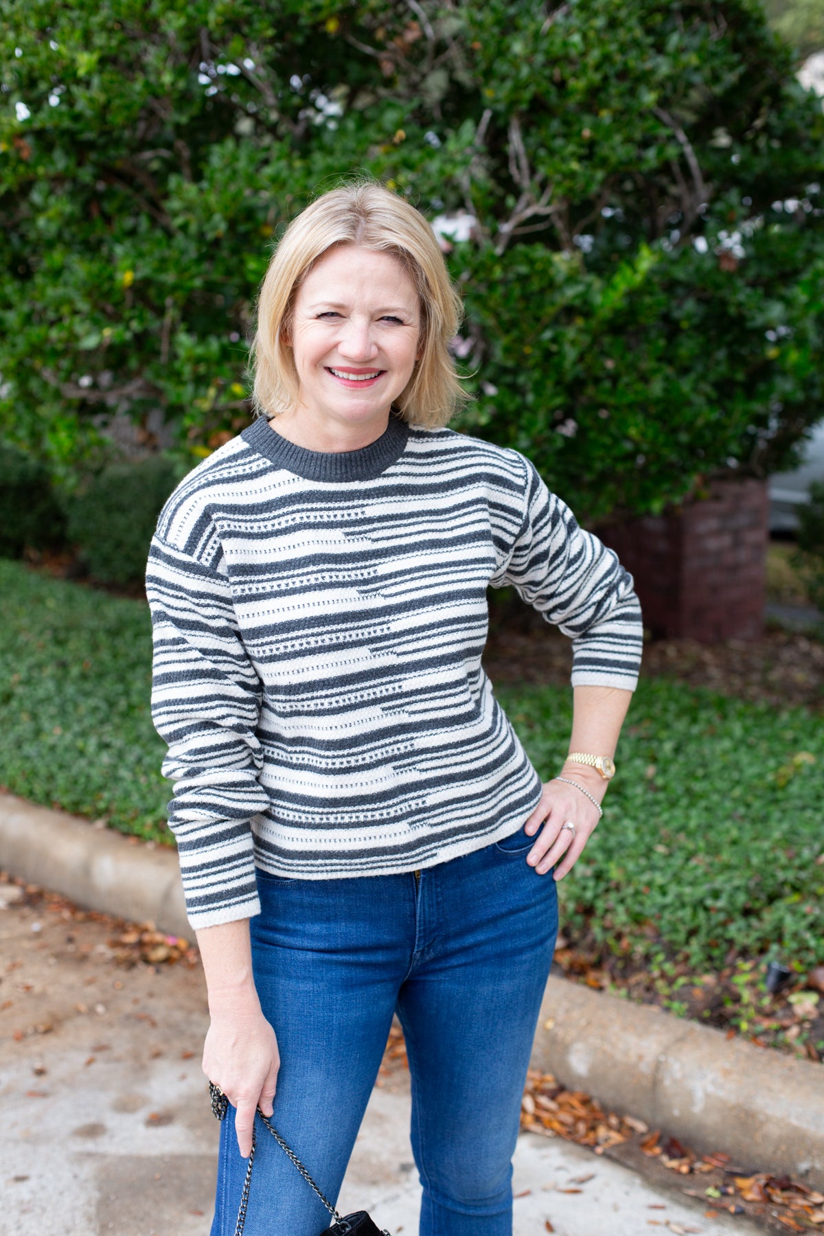 Long sleeve striped sweater with a round neckline.