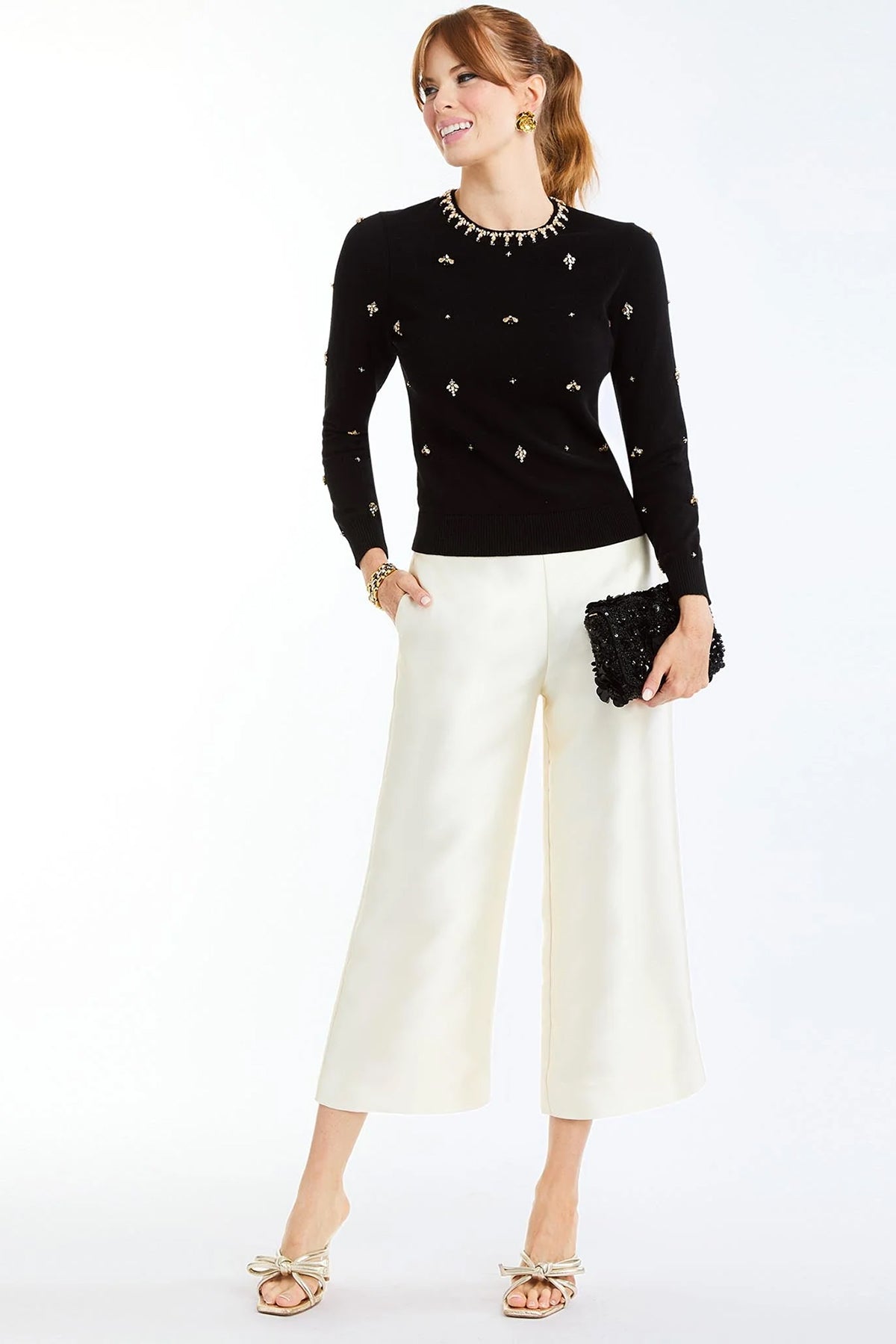 Cream cropped tailored pants with a straight-leg silhouette.