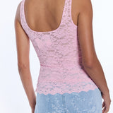 back of woman in pink lace tank top on white background 