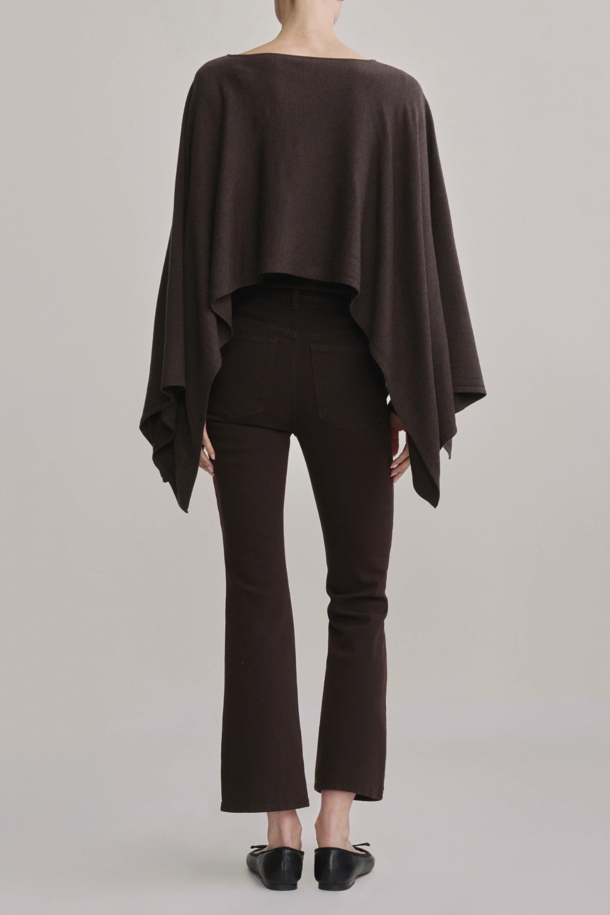 Women's dark-wash high-rise cropped bootcut jeans featuring a streamlined fit through the hip and thigh.