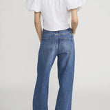 Blouse with dramatic voluminous sleeves styled with denim