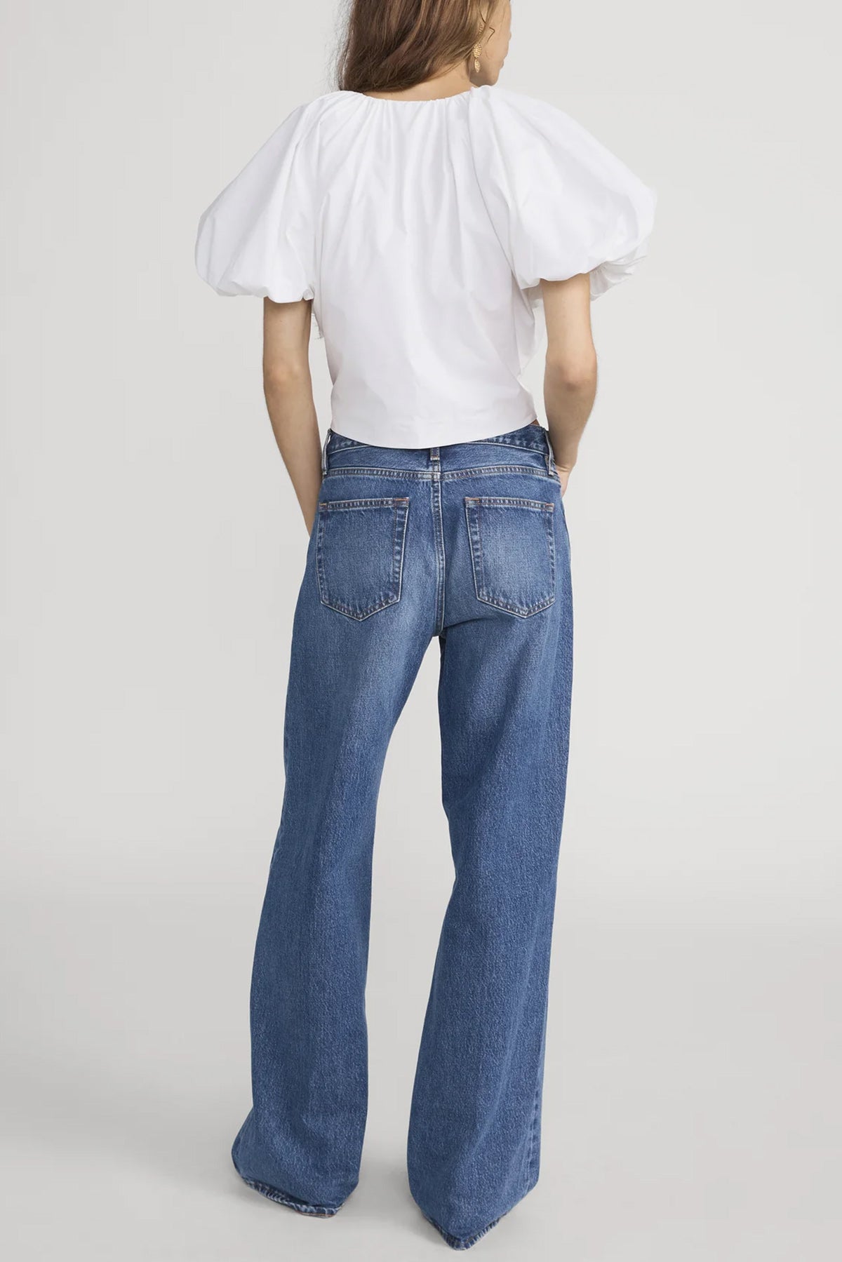 Blouse with dramatic voluminous sleeves styled with denim