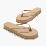 Pair of beige flip-flops on a white background