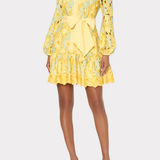 Yellow floral dress with a bow detail on a white background