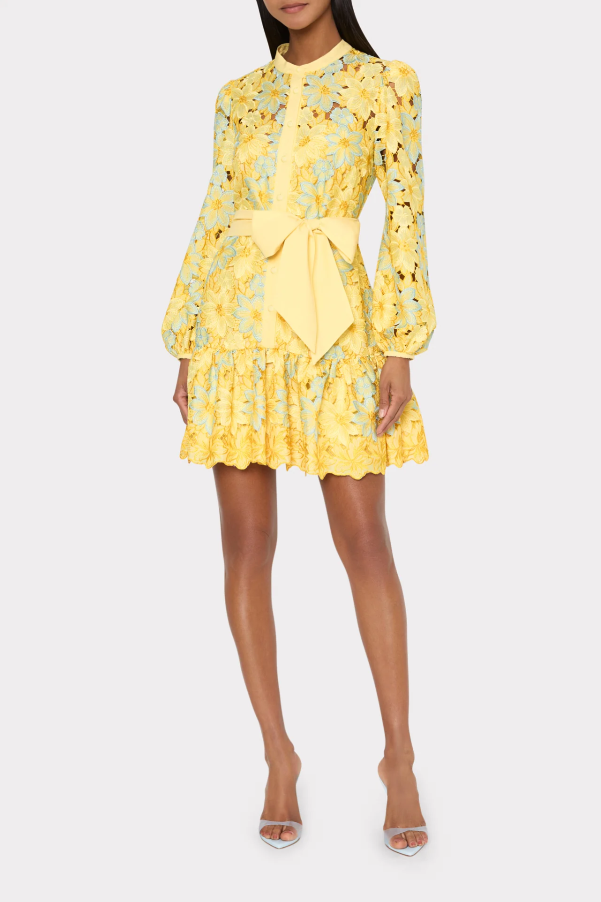 Yellow floral dress with a bow detail on a white background