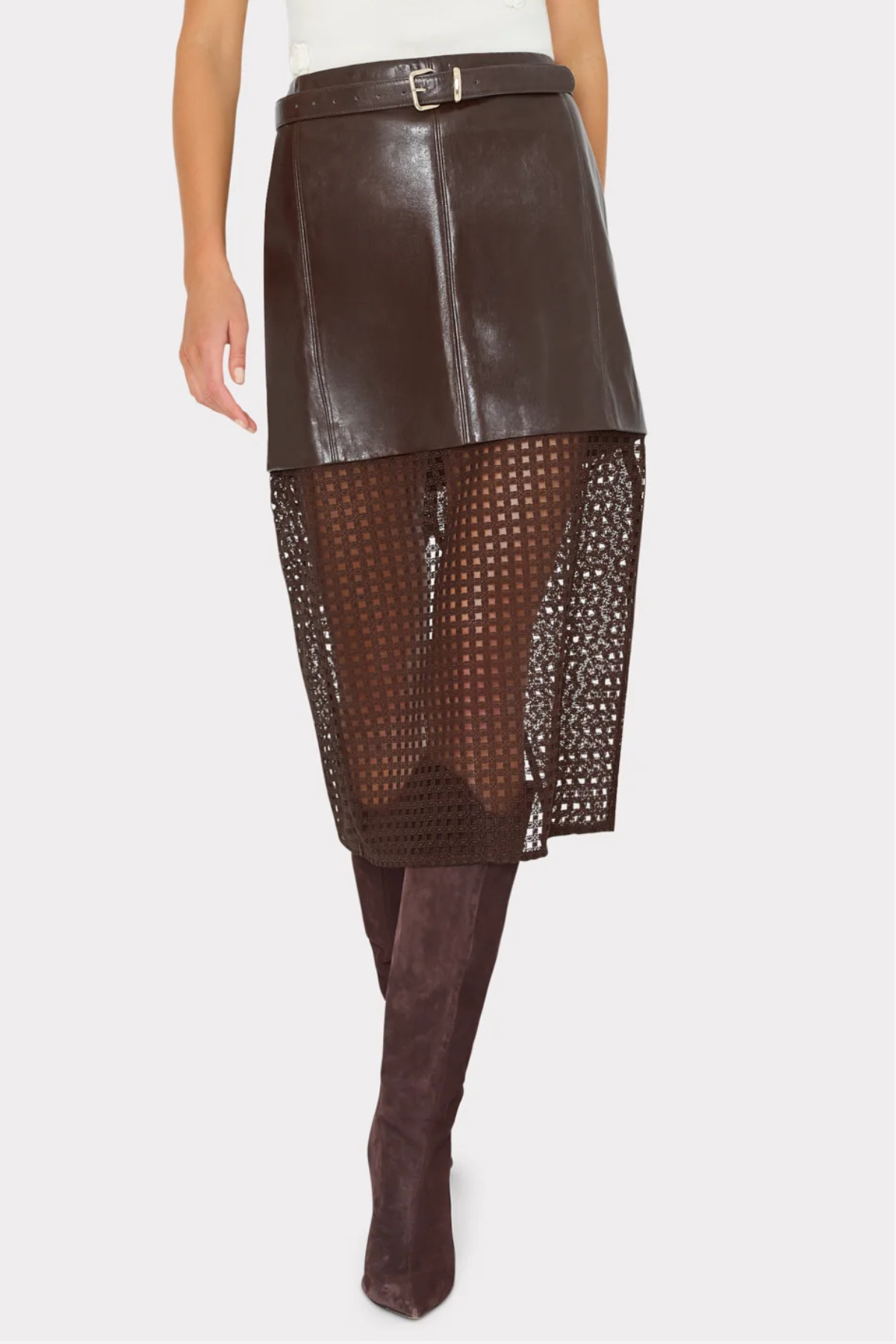 A dark brown faux-leather and mesh skirt with a matching belt, shown on a model wearing brown knee-high boots against a light gray background.