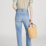 Model wearing a light green printed blouse with a relaxed silhouette