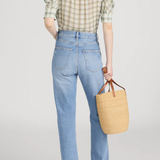 Model wearing a light green printed blouse with a relaxed silhouette