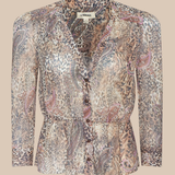 Patterned blouse on a beige background