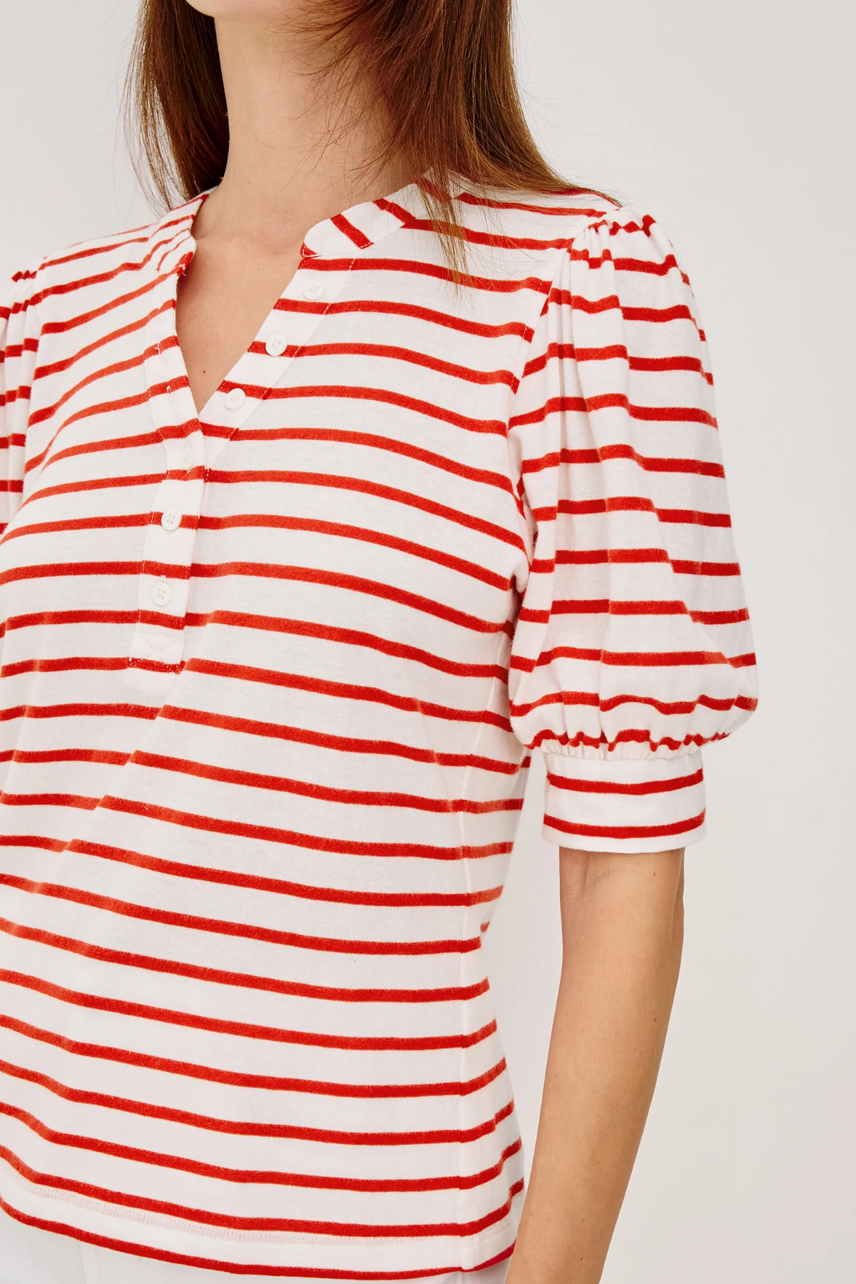 red and white stripe top on white background 