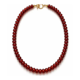 A beaded necklace made of small, dark red round beads with a gold clasp, shown on a plain white background.