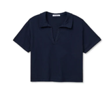 Navy blue polo shirt on a white background
