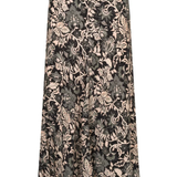 A high-waisted, floor-length A-line skirt featuring an intricate floral and botanical damask pattern in black, beige, and gray tones, shown against a plain white background.