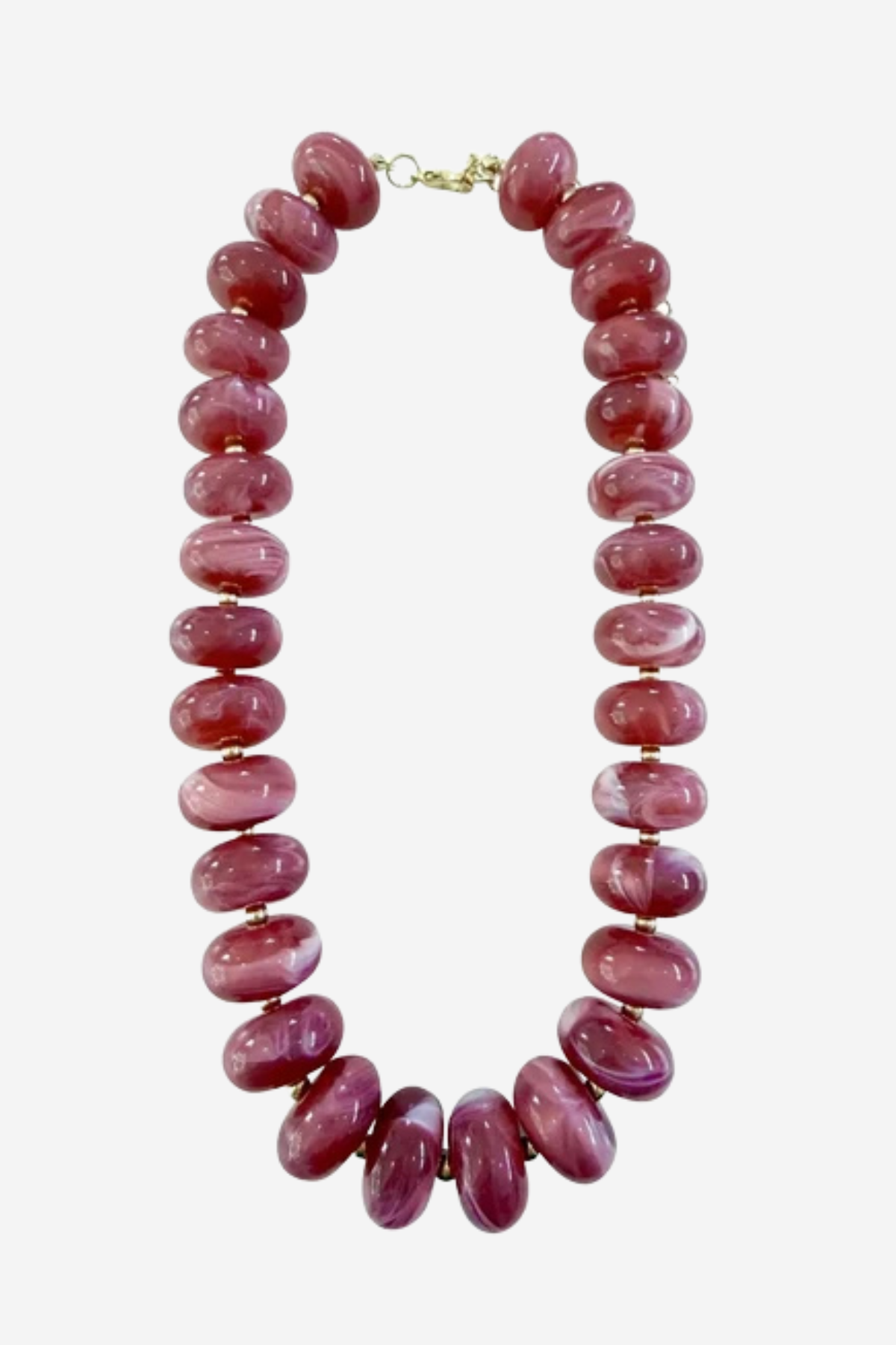 A chunky beaded necklace made of polished oval beads in a dusty rose pink color, separated by small gold spacer beads and finished with a gold clasp, shown on a light gray background.