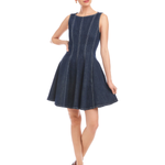 Woman wearing a navy blue dress on a white background
