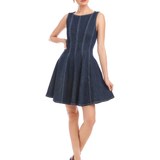 Woman wearing a navy blue dress on a white background