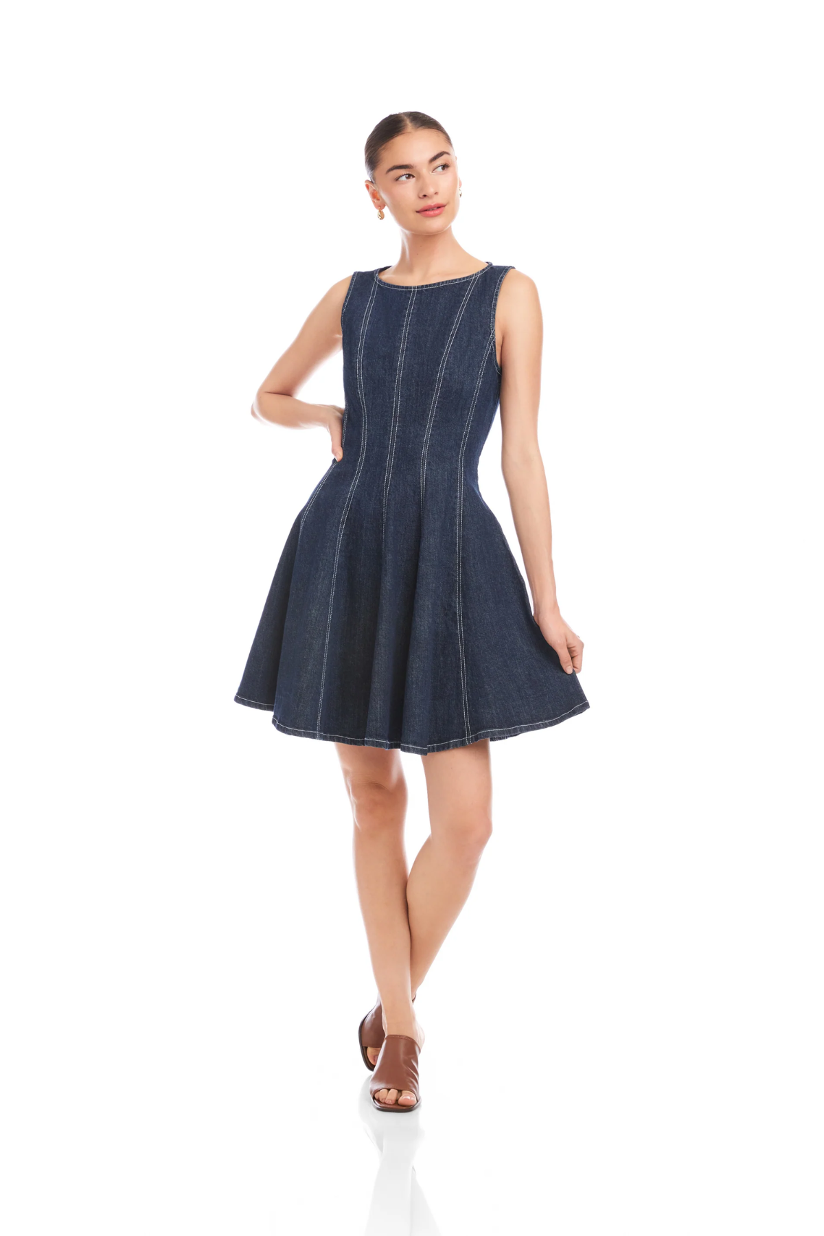 Woman wearing a navy blue dress on a white background