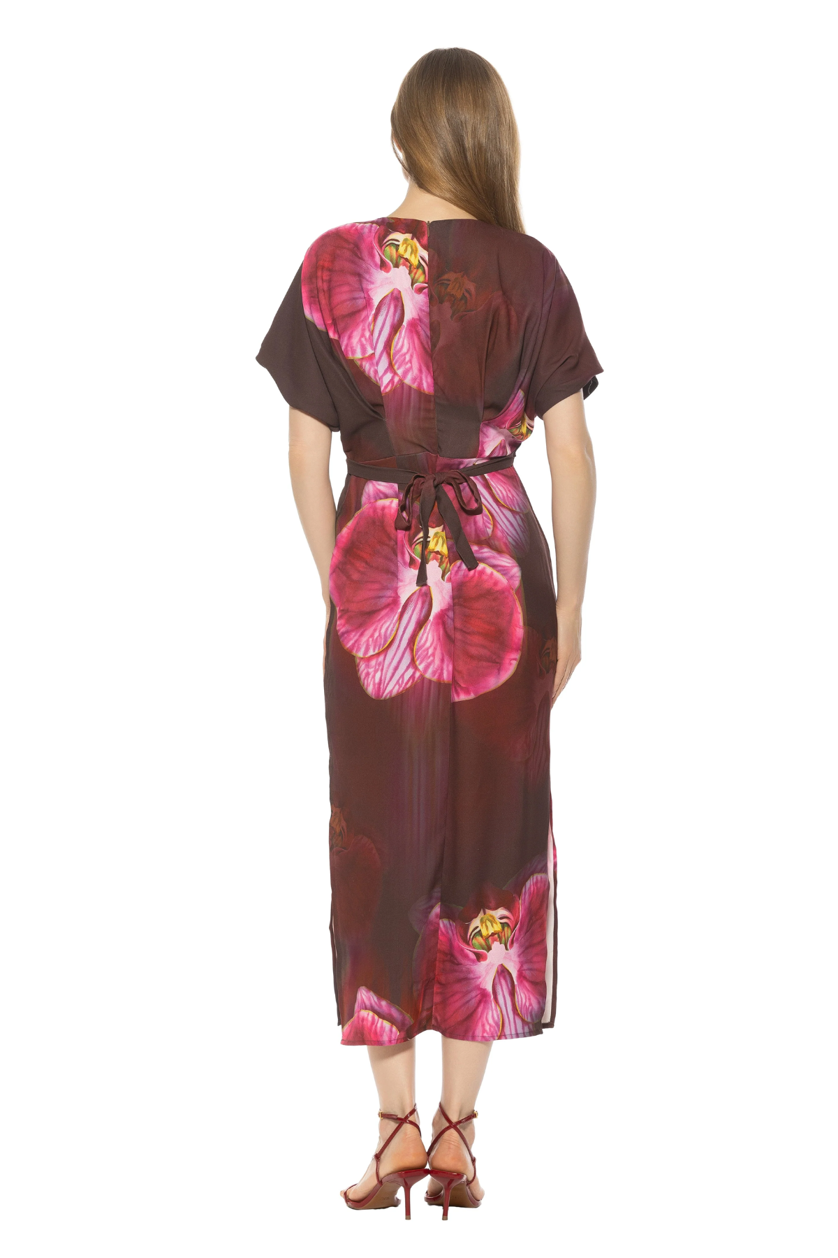 back of woman in floral printed dress on white background 