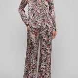 Floral and leopard print pajama set on a plain background