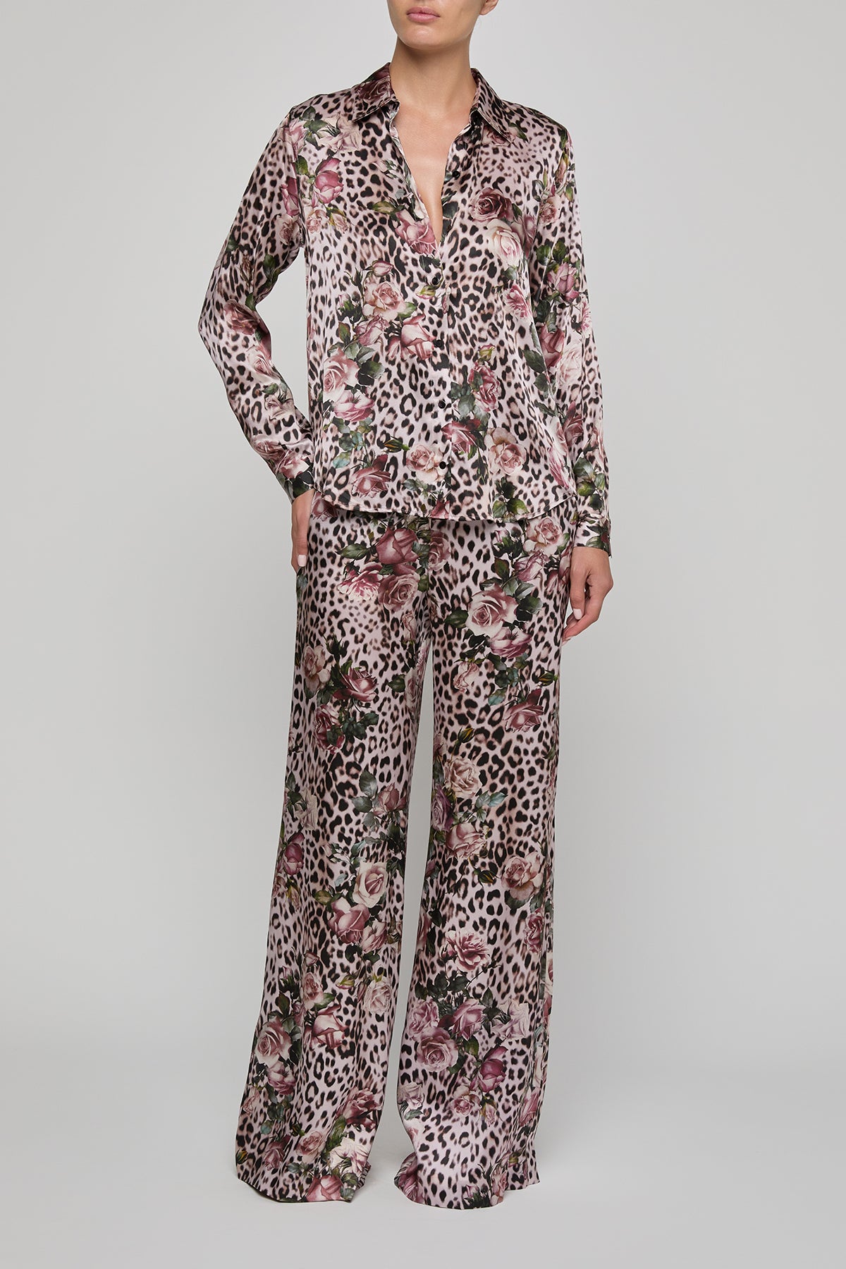 Floral and leopard print pajama set on a plain background