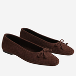 A pair of dark brown woven ballet flats with small bow details on the toes, displayed against a light gray background.