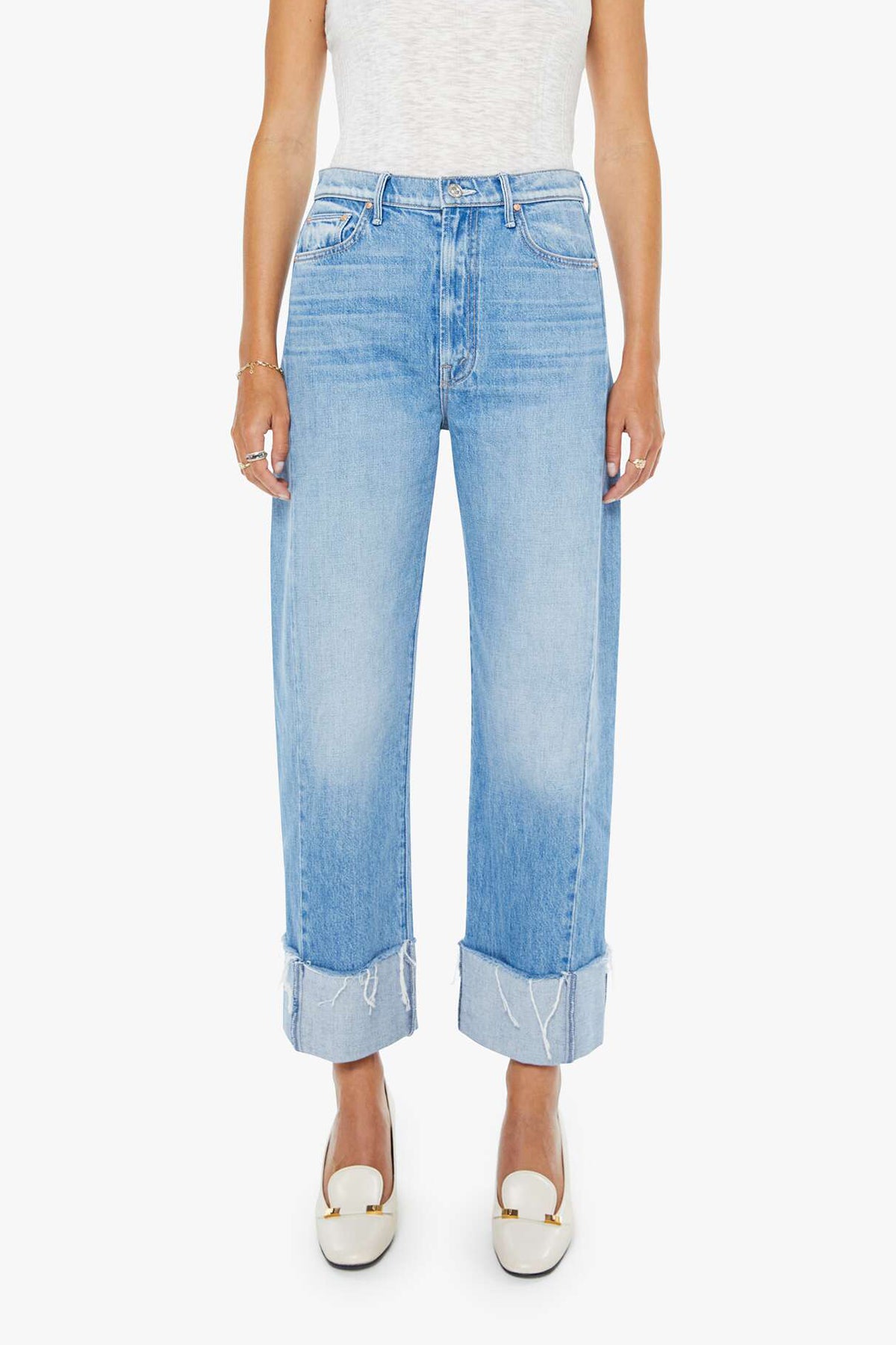 Light blue jeans worn by a person on a white background