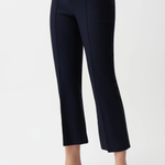 Navy blue pants worn by a person on a white background