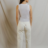 back of woman in stripe top and denim 