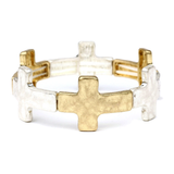 Gold and silver cross-shaped ring on a white background