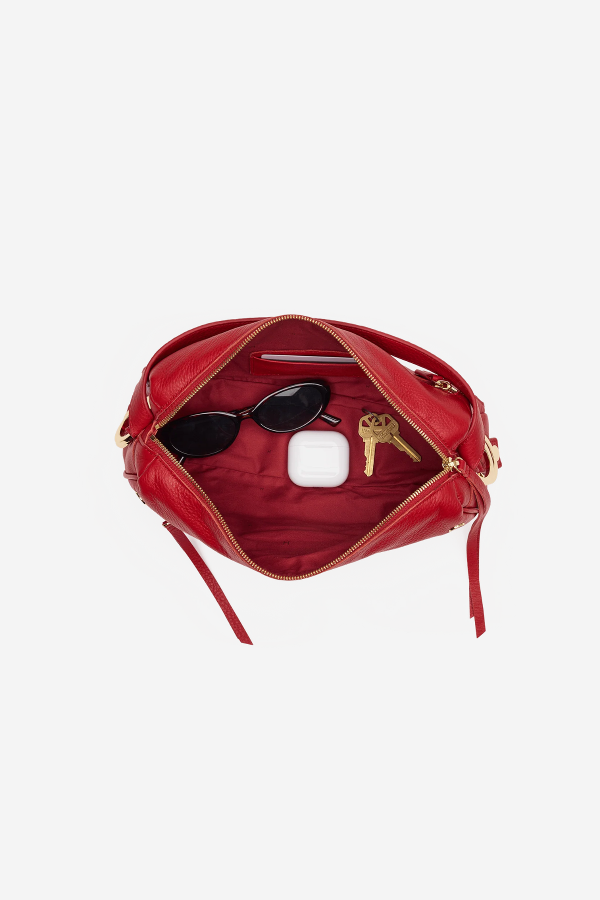 Medium-sized structured leather handbag in a rich red hue featuring a top handle and detachable shoulder strap.