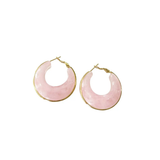 Pink hoop earrings with gold accents on a white background