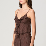 Model wearing a mahogany and ecru color-block camisole with adjustable straps.