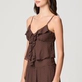 Model wearing a mahogany and ecru color-block camisole with adjustable straps.