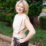 Sleeveless knit muscle sweater vest styled with trousers