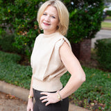 Sleeveless knit muscle sweater vest styled with trousers