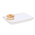 A white rectangular ceramic tray with rounded corners and a thin gold rim, featuring a small donut decoration on one corner, set against a plain white background.