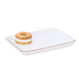 A white rectangular ceramic tray with rounded corners and a thin gold rim, featuring a small donut decoration on one corner, set against a plain white background.