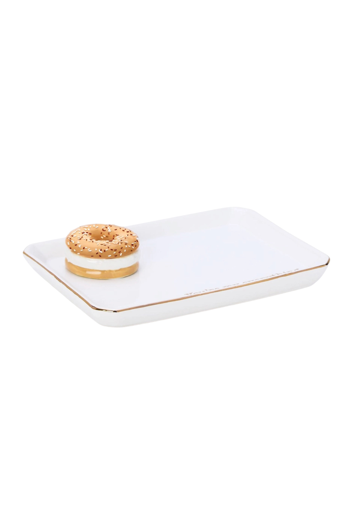 A white rectangular ceramic tray with rounded corners and a thin gold rim, featuring a small donut decoration on one corner, set against a plain white background.