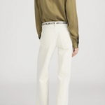 Model wearing an olive green utility button-front shirt with chest pockets and long sleeves.