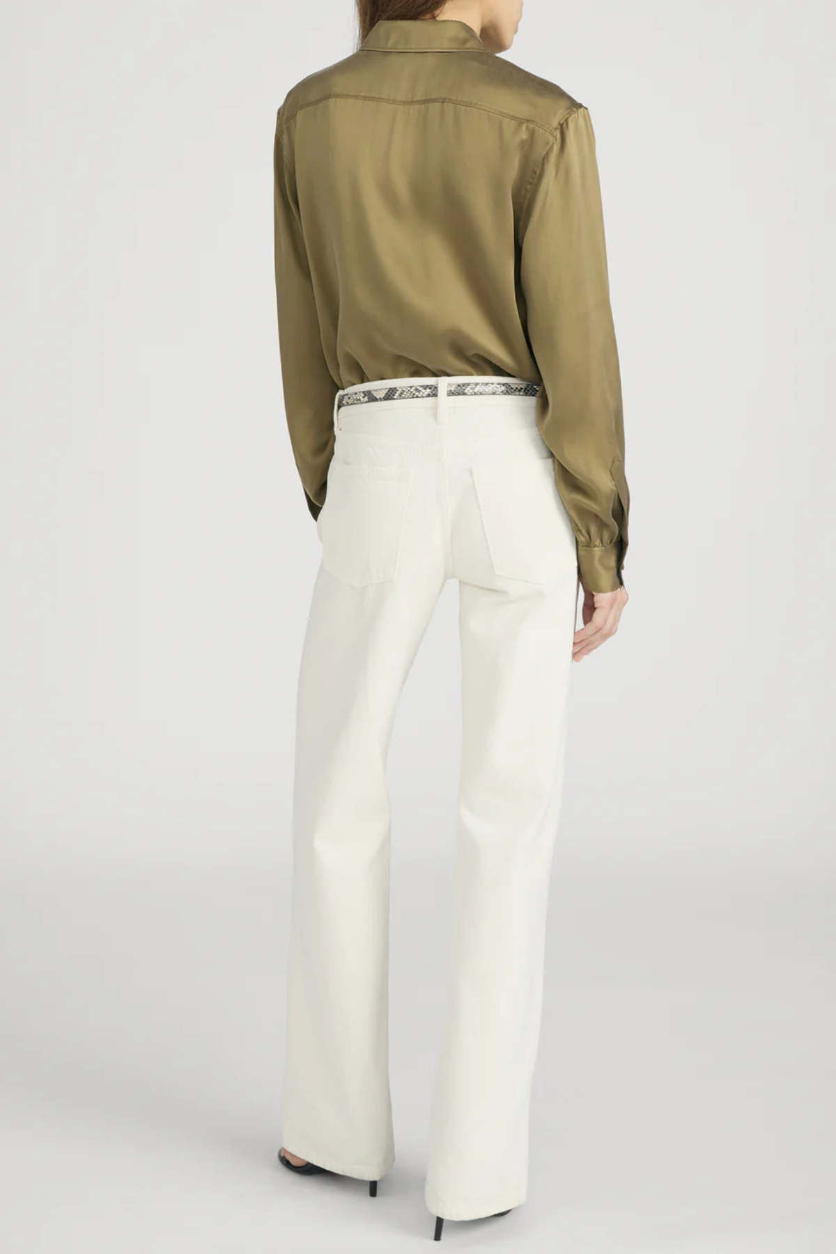 Model wearing an olive green utility button-front shirt with chest pockets and long sleeves.