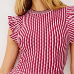 Red and white striped top with ruffled sleeves on a plain background